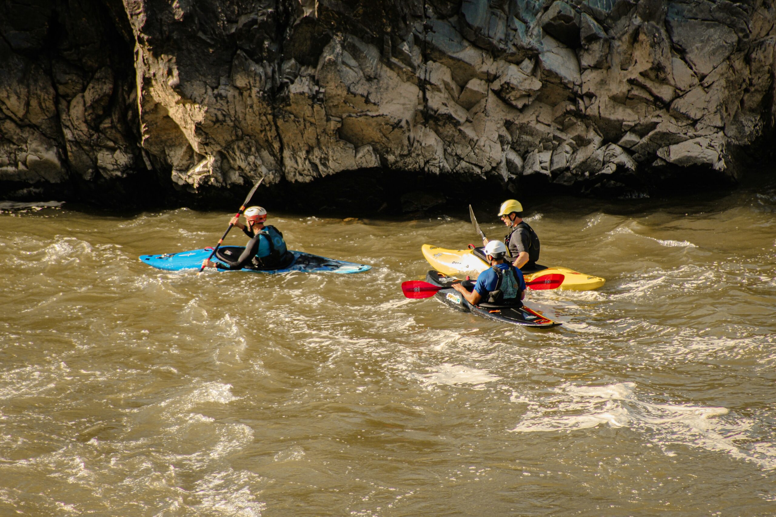 Men kayaking together on the river at Great Falls, Fairfax, Virginia.